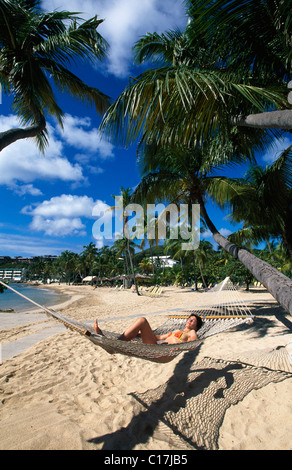 Woman in a hammock on Bolongo Beach, St. Thomas Island, United States Virgin Islands, Caribbean Stock Photo