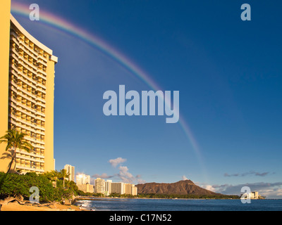 Rainbow at Waikiki over Diamond Head crater. Stock Photo