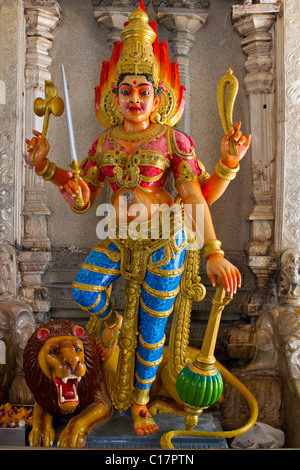 Hindu Goddess Durga on Lion with Trident in Temple Stock Photo