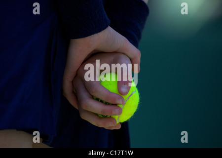 A ball girl holds a ball at the All England Lawn Tennis Championships at Wimbledon, London, England on Tuesday, June 30, 2009.  Stock Photo