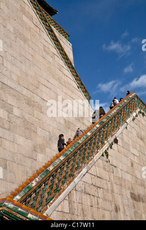 Tourists walking on steps of Summer Palace, Beijing, China Stock Photo