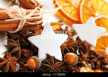 Christmas platter with decorative stars, cinnammon sticks, star anise and dried orange slices Stock Photo