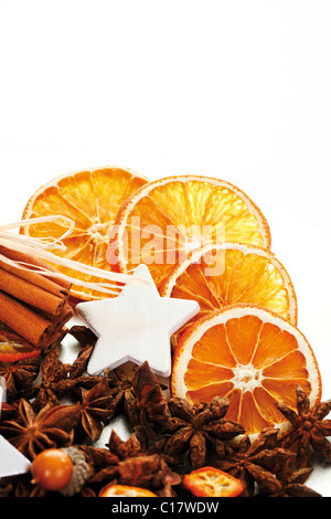 Christmas platter with decorative star, cinnamon sticks, star anise and dried orange slices Stock Photo