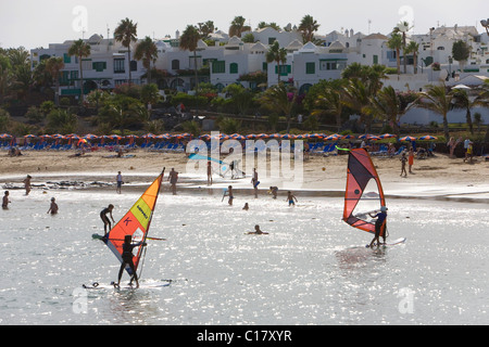 Surf Paradise surfing school, on the Playa Las Cucharas beach, Costa Teguise, Lanzarote, Canary Islands, Spain, Europe Stock Photo