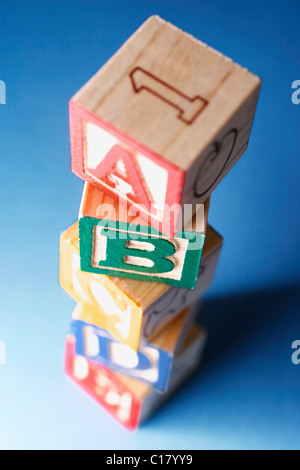 Stack of childrens wooden alphabet blocks Stock Photo