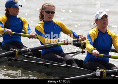A crew team from the University of Delaware competes in the George Washington University Rowing Regatta on the Potomac River. Stock Photo