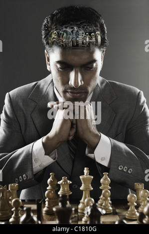 Businessman playing chess Stock Photo