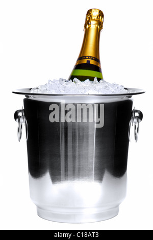 Photo of a champagne bottle in a silver ice bucket isolated on a white background. Stock Photo