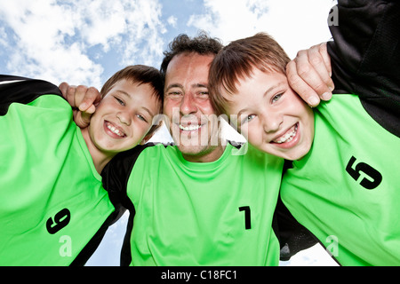 Father and sons team pep talk Stock Photo