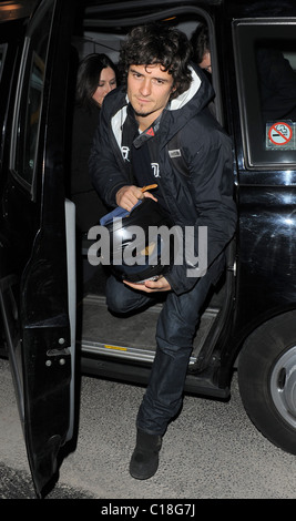 Orlando Bloom arrives at Automat restaurant for dinner with friends, wearing a motorbike jacket and carrying a helmet. It Stock Photo