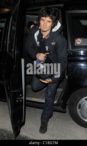 Orlando Bloom arrives at Automat restaurant for dinner with friends, wearing a motorbike jacket and carrying a helmet. It Stock Photo