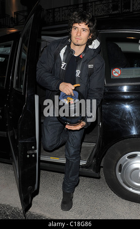 Orlando Bloom arrives at Automat restaurant for dinner with friends, wearing a motorbike jacket and carrying a helmet. It Stock Photo