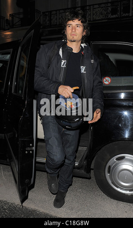 Orlando Bloom arrives at Automat restaurant for dinner with friends, wearing a motorbike jacket and carrying a helmet. It Stock Photo