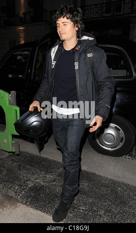 Orlando Bloom arrives at Automat restaurant for dinner with friends, wearing a motorbike jacket and carrying a helmet. It Stock Photo