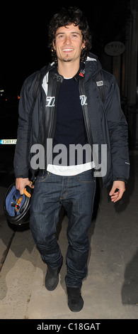 Orlando Bloom arrives at Automat restaurant for dinner with friends, wearing a motorbike jacket and carrying a helmet. It Stock Photo