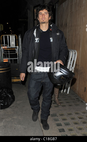 Orlando Bloom arrives at Automat restaurant for dinner with friends, wearing a motorbike jacket and carrying a helmet. It Stock Photo