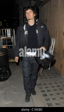 Orlando Bloom arrives at Automat restaurant for dinner with friends, wearing a motorbike jacket and carrying a helmet. It Stock Photo