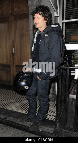 Orlando Bloom arrives at Automat restaurant for dinner with friends, wearing a motorbike jacket and carrying a helmet. It Stock Photo