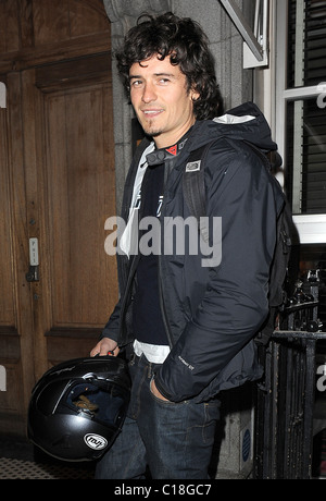 Orlando Bloom arrives at Automat restaurant for dinner with friends, wearing a motorbike jacket and carrying a helmet. It Stock Photo