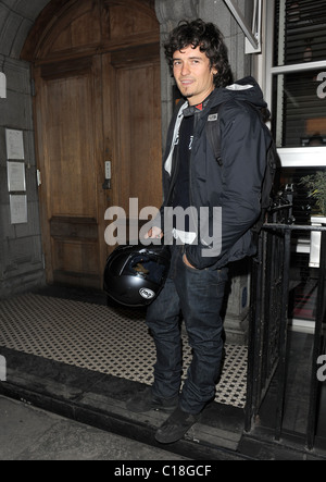 Orlando Bloom arrives at Automat restaurant for dinner with friends, wearing a motorbike jacket and carrying a helmet. It Stock Photo