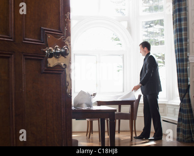 Man setting up table Stock Photo