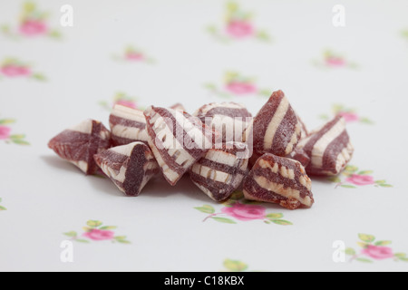 mint humbugs, sweets and candy on a paper background photographed in a studio Stock Photo