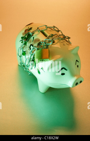 Piggybank with padlock and chain Stock Photo