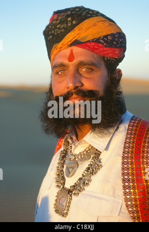 Mr Desert in traditional Rajput dress, at sand dunes near Jaisalmer, Rajasthan, India Stock Photo