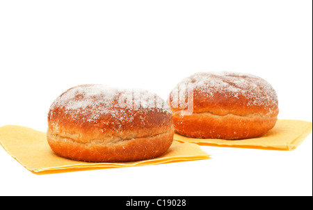 two donuts in powdered sugar on paper napkins Stock Photo
