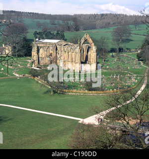 Looking down from above on ruins of Bolton Abbey also known as Bolton Priory with active Parish church at rear & fenced off graveyard in Wharfedale UK Stock Photo