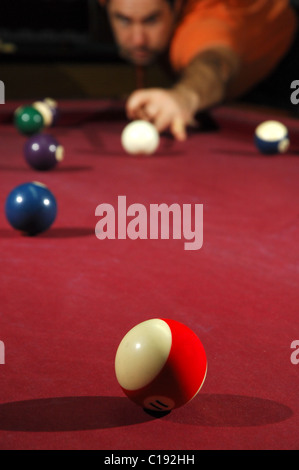 Snooker player taking a long shot across the table  Stock Photo