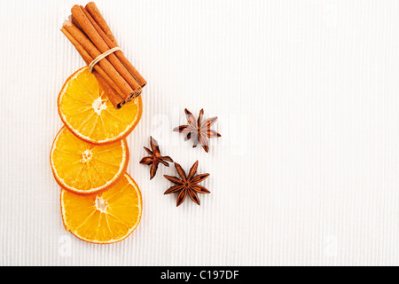 Dried slices of orange with cinnamon sticks and anise stars Stock Photo