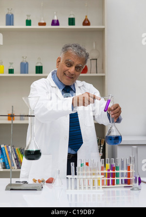 Scientist doing scientific experiment in a laboratory Stock Photo