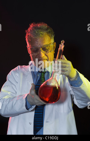 Scientist holding a chemical flask Stock Photo