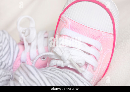 pink baby shoes close up with macro lens Stock Photo