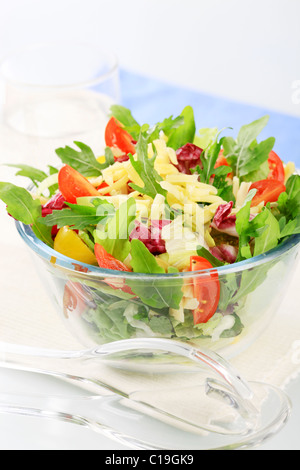 Bowl of spring salad sprinkled with grated cheese Stock Photo