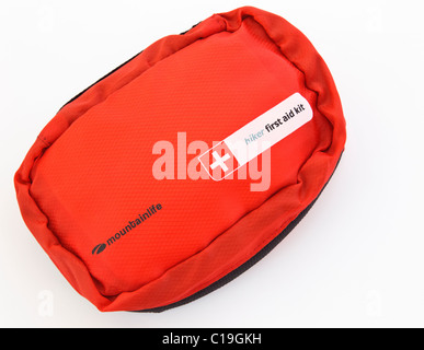 Hiker's first aid kit in a red bag isolated on a white background. England UK Stock Photo