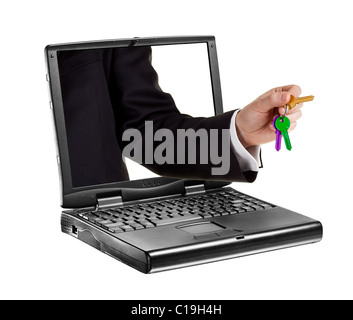 Black portable computer. Hand with keys coming out from the screen, isolated. Stock Photo