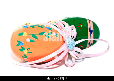 Colorful hand painted Easter eggs with ribbons. Stock Photo