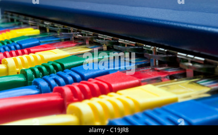 Macro closeup on colored network cables attached to a router or switch Stock Photo