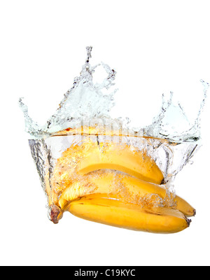 Bunch of bananas in water splash isolated on white background Stock Photo
