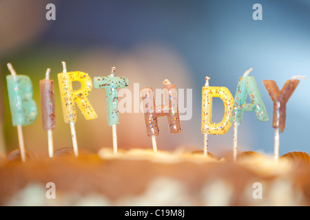 Candles saying Birthday on a cake Stock Photo