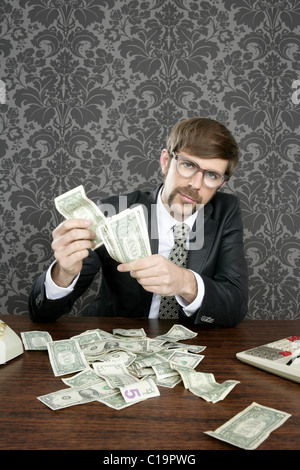 businessman nerd accountant dollar notes on vintage wallpaper office Stock Photo