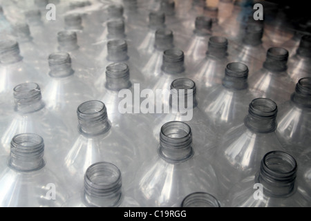 https://l450v.alamy.com/450v/c19rgg/bottle-rows-stacked-wrapped-in-plastic-c19rgg.jpg