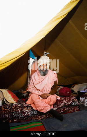 Sadhu sitting in a tent, Haridwar, Uttarakhand, India Stock Photo