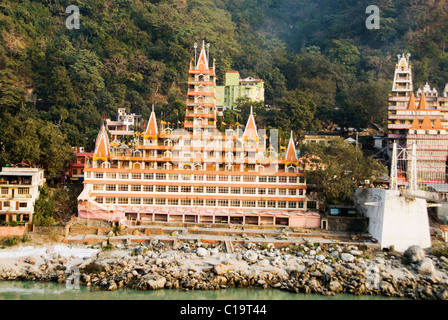 Temples at the riverbank, Swarg Niwas Temple, Ganges River, Rishikesh, Uttarakhand, India Stock Photo