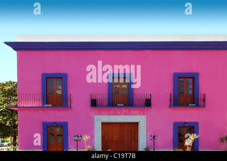 Mexican pink house facade detail wooden doors Stock Photo