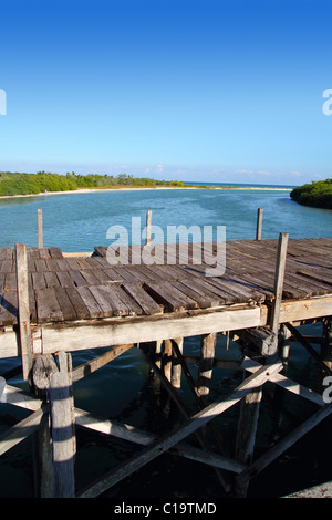 aged tropical wood bridge in Sian Kaan Tulum mexico Stock Photo