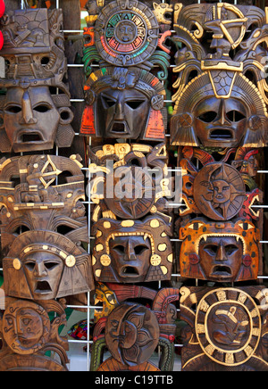 aztec mayan wooden Mexican indian mask handcrafts in rows Stock Photo