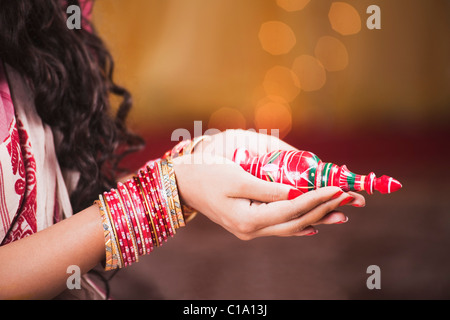 Bride holding sindoor in Bengali wedding Stock Photo